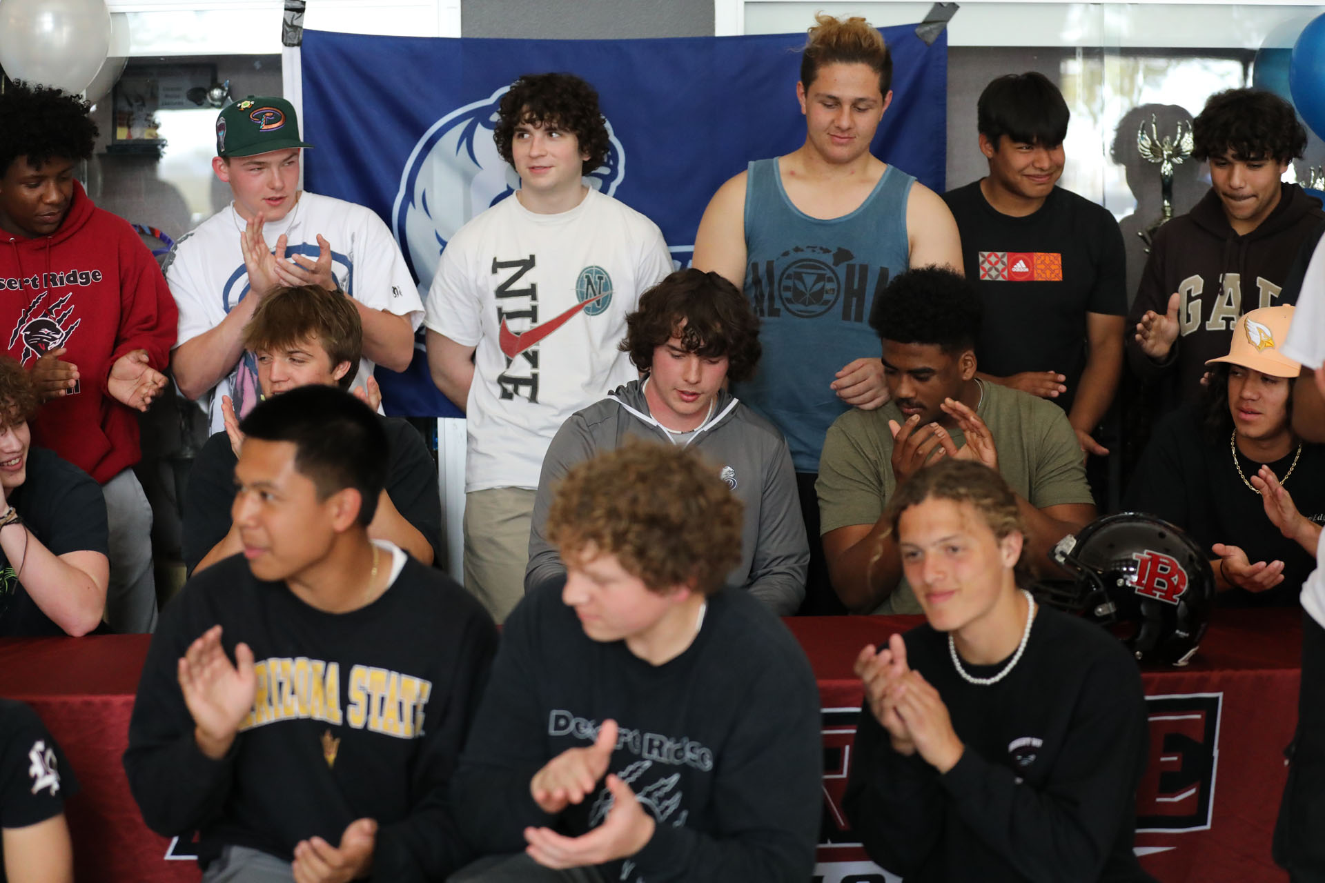 Teammates celebrate Jacobs signing with Drake Football