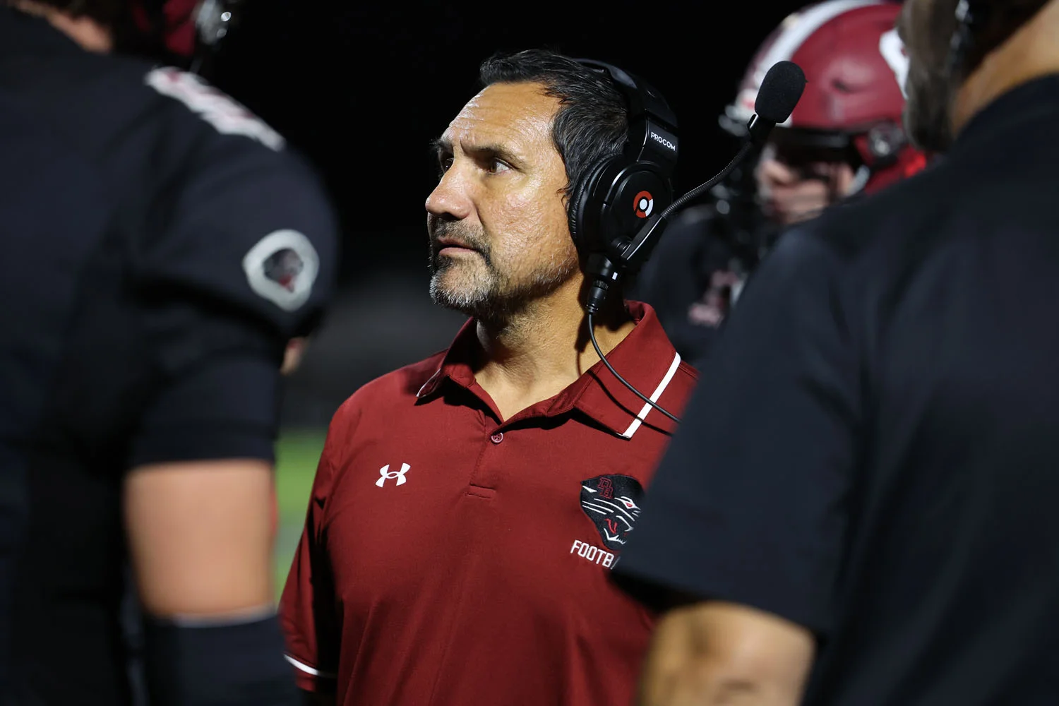 Coach Johns talking to his players